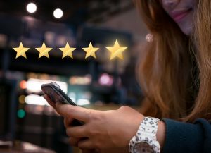 woman-submitting-5-star-local-review