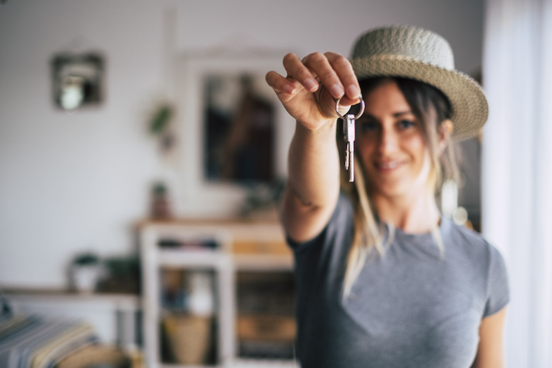 Crop close up of female tenant renter show praise house keys moving to first own new apartment or house, happy woman owner buy purchase home, relocate to dwelling, rental, rent, ownership concept